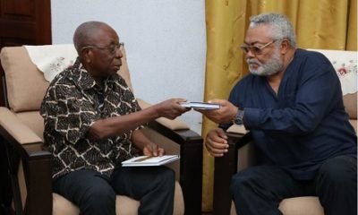 Former clerk of Parliament presents books to Rawlings
